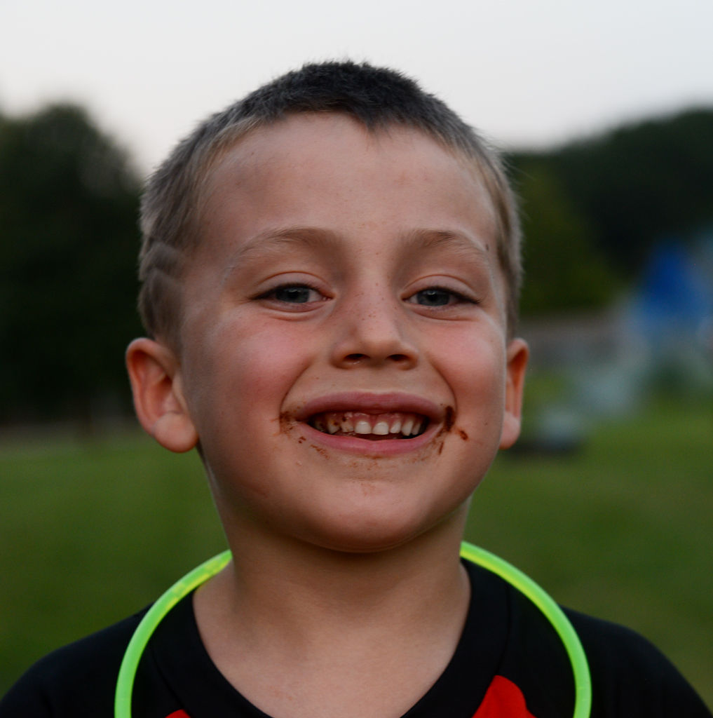 Dylan Kelley, 6, takes a moment between after his s'more